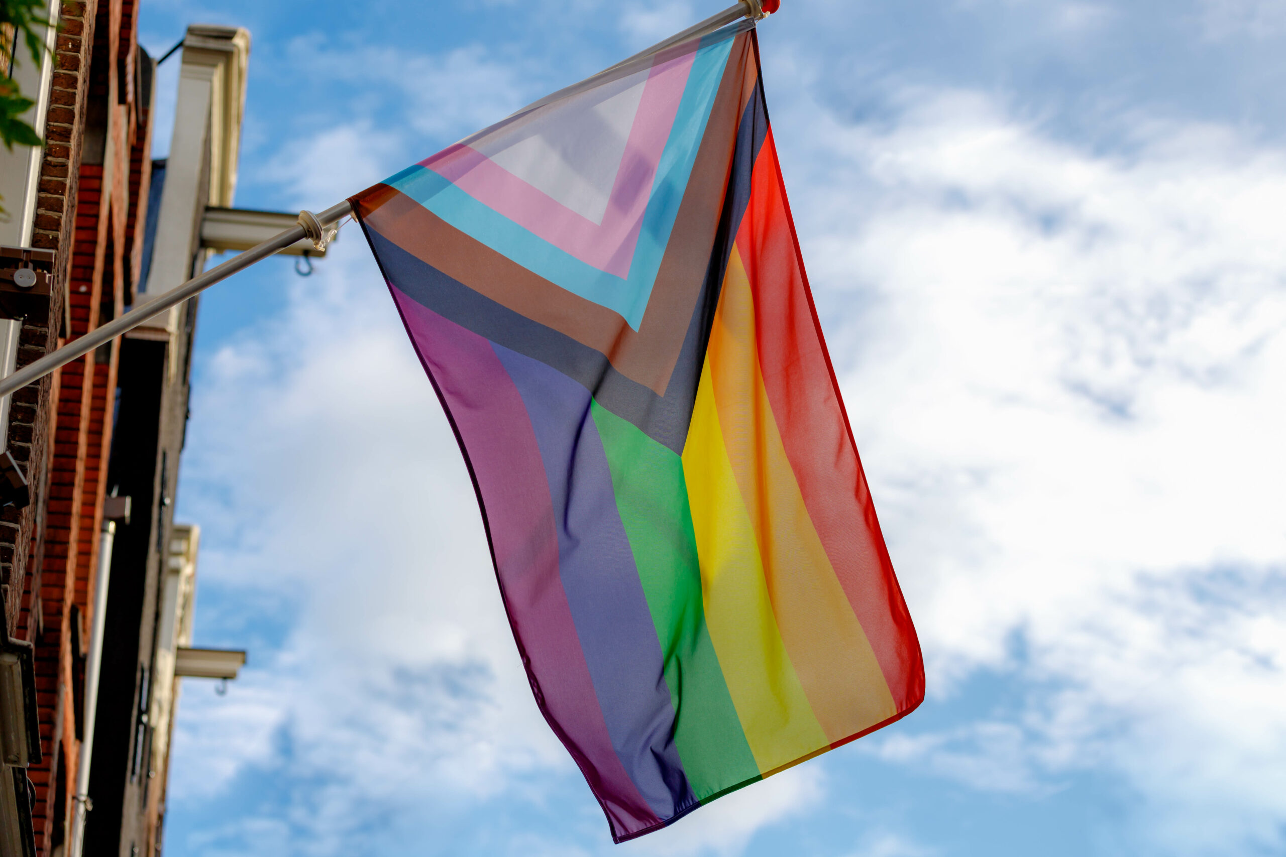 Progress Pride Flag new Design Of Rainbow Flag Waving In The Air With Blue Sky Celebration Of 